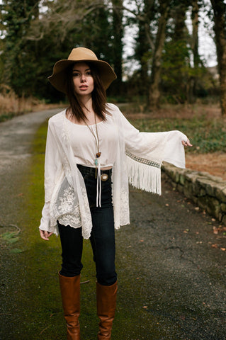 Model Olivia Rose wearing Arrow Howlite Turquoise Tassle Necklace
