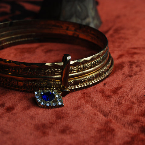 Evil Eye Gold Plated Set of Bangles with floral texture. Blue Rhinestone All Seeing Eye.