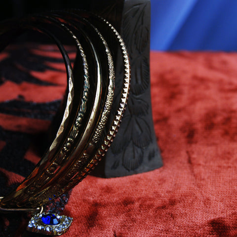 Evil Eye Gold Plated Set of Bangles with floral texture. Blue Rhinestone All Seeing Eye.