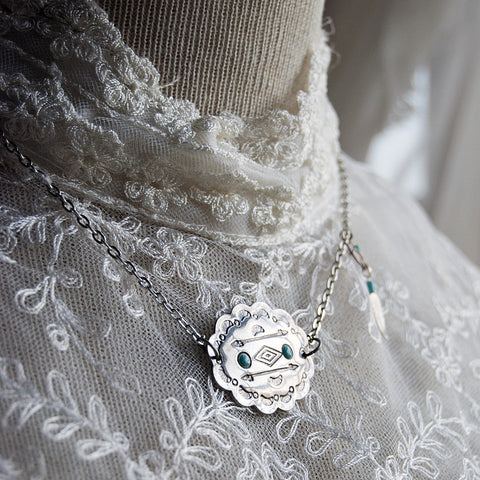 Southwestern geometric silver pendant with dreamcatcher charm. Silver Chain.
