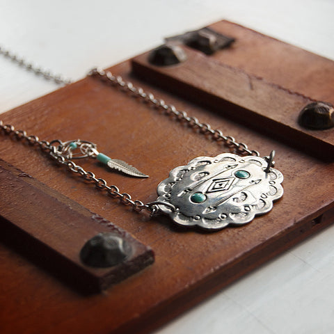 Southwestern geometric silver pendant with dreamcatcher charm. Silver Chain.